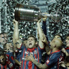 San Lorenzo (arriba) logr el ttulo de la Copa Libertadores y River Plate de la Copa Sudamericana.